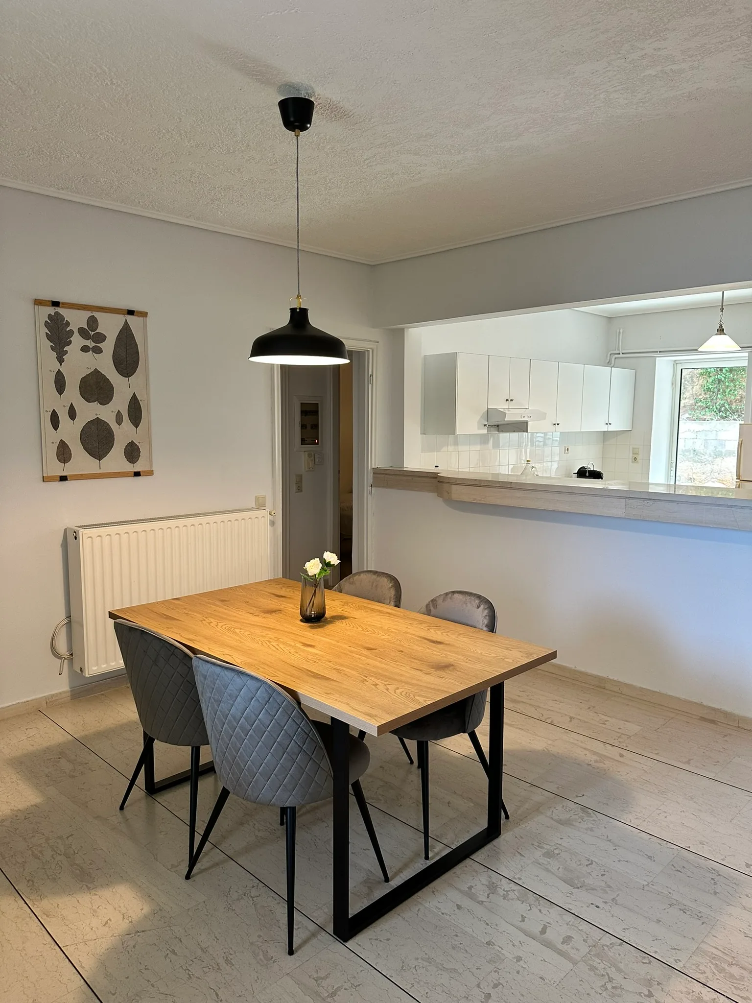 Aegean Hill Retreat dining area beside the kitchen pass-through.