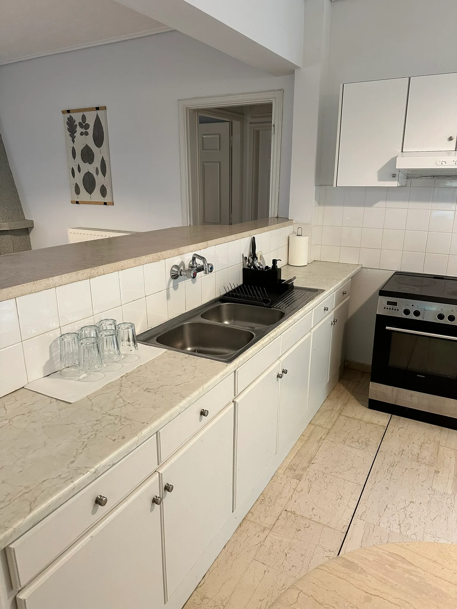 Aegean Hill Retreat kitchen with sink, counter space, and oven.