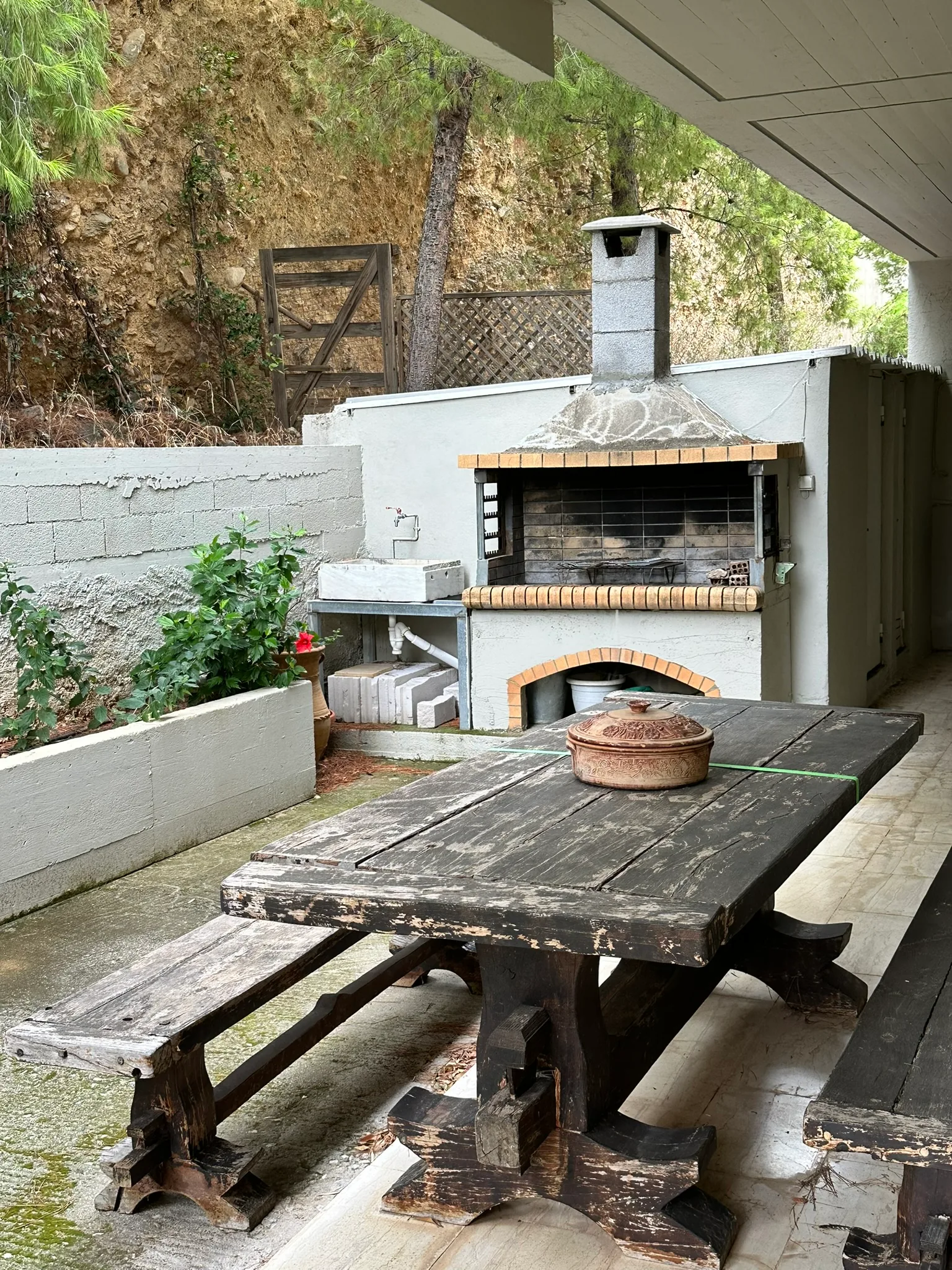 Aegean Hill Retreat outdoor dining and barbecue corner.