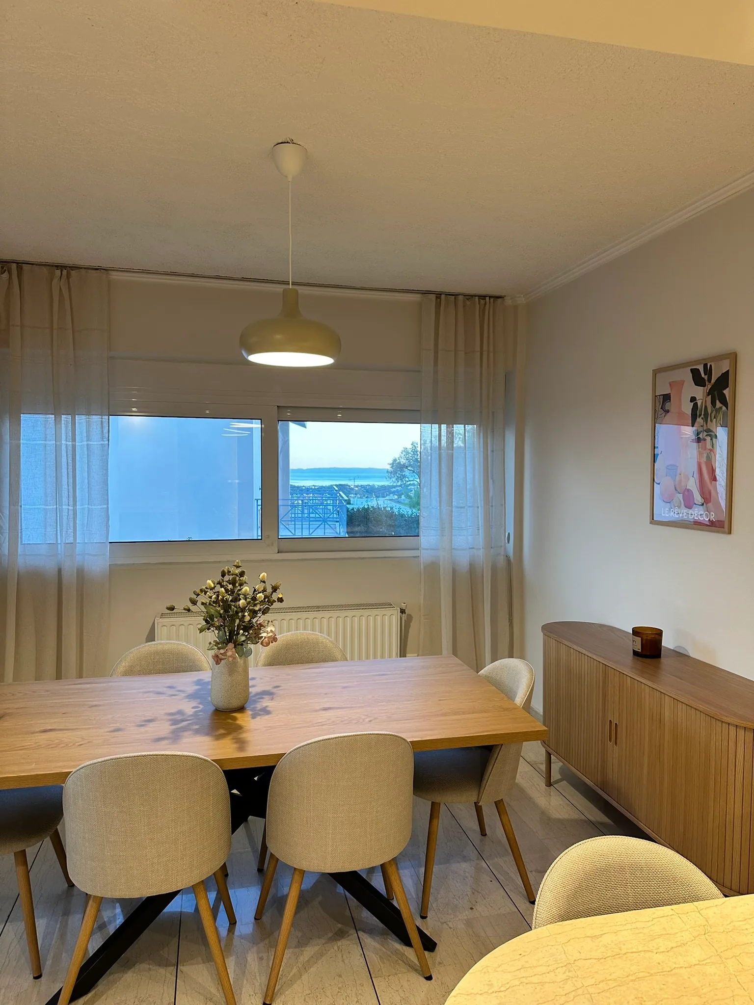 Aegean Hill SkyView dining area with partial sea view.