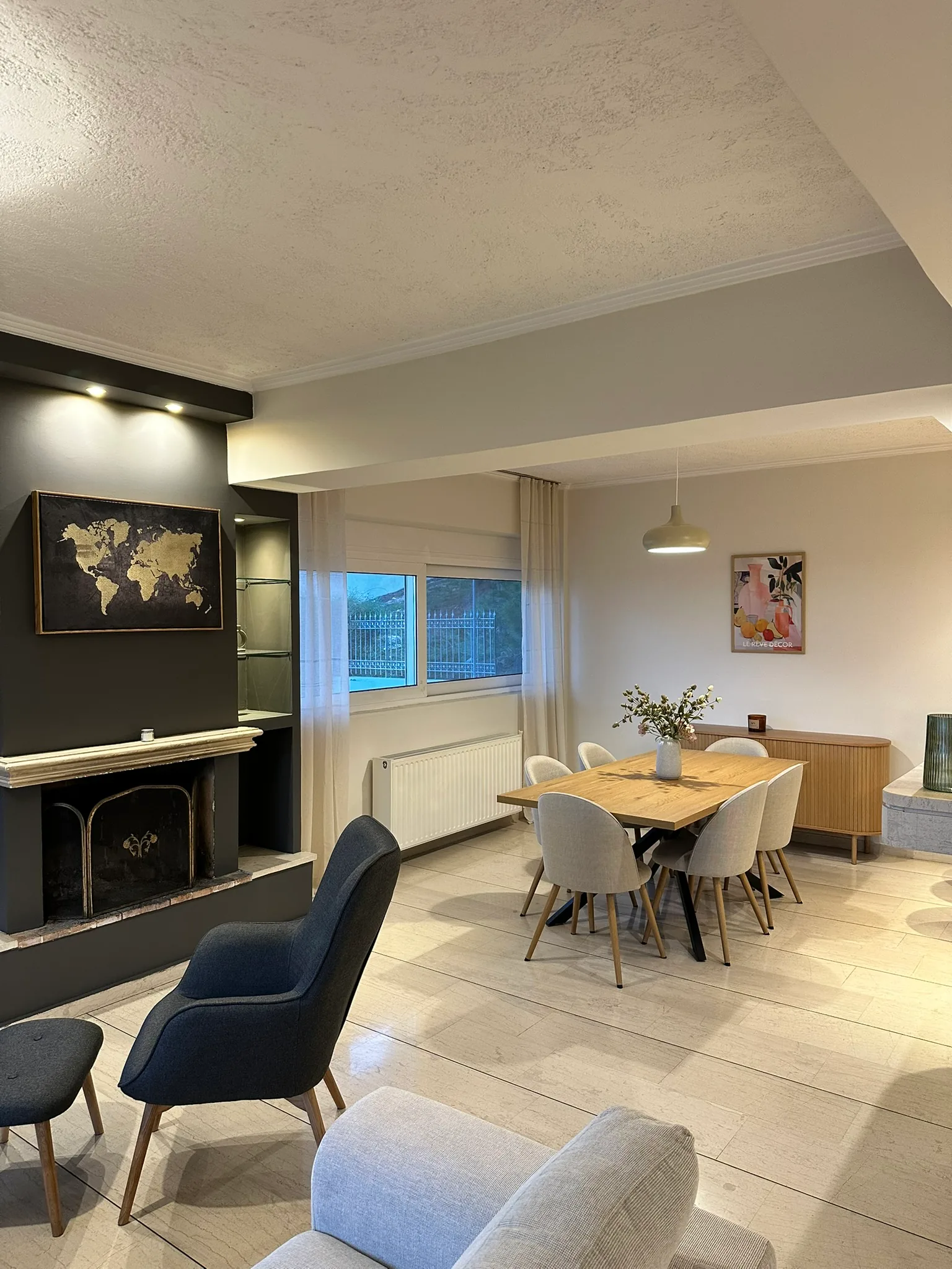 Aegean Hill SkyView dining and lounge area with fireplace detail.